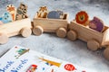 Children`s wooden toys. Children wooden freight train with wagons Royalty Free Stock Photo