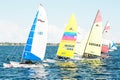 Children sailing competition in dinghies.