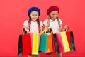 Children satisfied by shopping red background. Obsessed with shopping and clothing malls. Shopaholic concept. Shopping