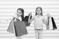 Children satisfied shopping striped background. Obsessed with shopping and clothing malls. Discount concept. Kids cute