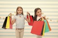 Children satisfied shopping striped background. Obsessed with shopping and clothing malls. Discount concept. Kids cute