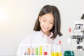 Children science concept, Happy little girl playing doing chemical experiments at the laboratory with white background Royalty Free Stock Photo