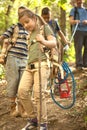 Children scouts and father explore the beautiful forest Royalty Free Stock Photo