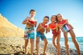 Children at sea. A group of children are eating a watermelon. Royalty Free Stock Photo