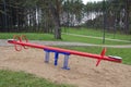 Children seesaw in park