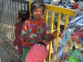 Children selling toys on the road