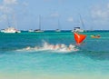 Children setting off on a swimming competition in the grenadines Royalty Free Stock Photo