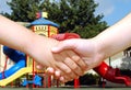 Children shaking hands Royalty Free Stock Photo