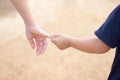 Children shaking hands with blur background,friendship,Girl hold one& x27;s hands walking in road blur background Royalty Free Stock Photo