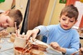 Children shaping clay in pottery studio Royalty Free Stock Photo