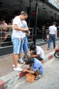 Children Shoeblacks in Thailand Royalty Free Stock Photo