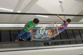 Children in Shopping Mall with Shopping Cart