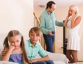 Children in silence while parents arguing