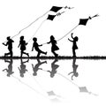 Children silhouettes playing with kites flying