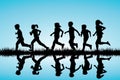 Children silhouettes running outdoor Royalty Free Stock Photo