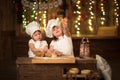 Children sisters cook with a rolling pin to stretch concept of