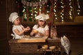 Children sisters cook with a rolling pin to stretch concept of