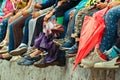Children`s feet. Bottom view. Spectators of a theatrical performance in the open air Royalty Free Stock Photo