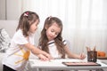 Children sit at the table and do their homework. The child learns at home. Home schooling Royalty Free Stock Photo