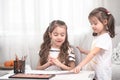 Children sit at the table and do their homework. The child learns at home. Home schooling Royalty Free Stock Photo