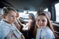 Children sitting in the back seat of the car Royalty Free Stock Photo