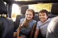 Children Sitting In Back Seat Of Open Top Car On Road Trip Royalty Free Stock Photo