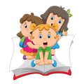 The children are sitting on the big book and waving Royalty Free Stock Photo