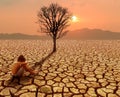 Children sitting on crack earth in arid area with dead tree and hot climate