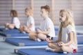 Children sitting in lotus pose Royalty Free Stock Photo