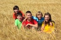 Children sitting in wheat field Royalty Free Stock Photo