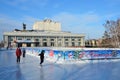 Barnaul, Russia, January, 13, 2016, Children skating on city ice rink in front of the Altay regional Drama theatre of Shukshin