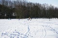 Children sledding in snowy winter. Berlin, Germany Royalty Free Stock Photo