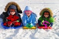 Children on sleds in snow Royalty Free Stock Photo