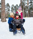 Children on sleds in snow