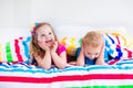 Children sleeping under colorful blanket Royalty Free Stock Photo