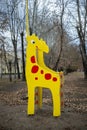 Children slide on the playground in the form of a giraffe.