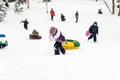 Children Sliding on Snow Slides in Russian Winter