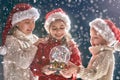 Children with snow globe Royalty Free Stock Photo