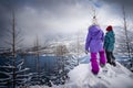 Children snowshoeing a winter hiking trail in Waterton National Park