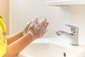 Children with soapy hands washed in bathroom sink. Royalty Free Stock Photo