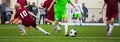 Children Soccer Football Players. Footballers Kicking Football Match Game on the Grass Royalty Free Stock Photo