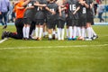 Children soccer team. Kids standing together on the pitch.