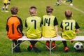 Children Soccer Team Sitting on a Bench. Kids Football Team Players Royalty Free Stock Photo