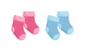 Children socks vector illustration set - pink and blue newborn wearing isolated on white background.