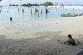 children and some people who are playing on the beach of Pari Island