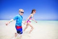 Children splashing in the ocean on a tropical beach vacation Royalty Free Stock Photo