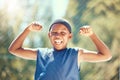 Children, sports and fitness with a strong boy flexing his biceps and having fun with sport outside. Kids, training and