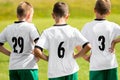 Children Sports Team Wearing White Soccer Jersey Shirts. Young Boys Watching Soccer Match. Football Tournament Competition