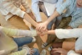 Children Stacking Hands and Huddling