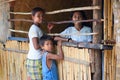 Children stand near the village shops